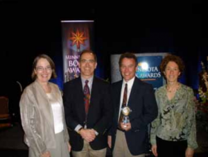 Peg Guilfoyle, John Guthmann, Dave Kenney and Cathy Spengler show off the Reader's Choice Award at the April 17 Minnesota Book Awards Gala.